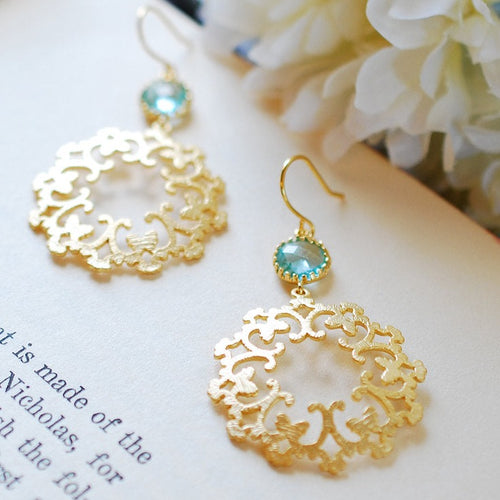 Gold Circle filigree pendant earrings with aquamarine blue crystals