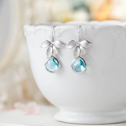 aqua blue crystal dangle earrings, silver orchid flower earrings