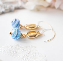 Load image into Gallery viewer, Cowrie Shell Earrings, Cowry Earrings, 18K Gold plated Blue Drop Earrings, Pacific Ocean Blue Swirl Lampwork Glass Bead, Beach Jewelry
