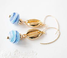 Load image into Gallery viewer, Cowrie Shell Earrings, Cowry Earrings, 18K Gold plated Blue Drop Earrings, Pacific Ocean Blue Swirl Lampwork Glass Bead, Beach Jewelry
