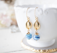 Load image into Gallery viewer, Cowrie Shell Earrings, Cowry Earrings, 18K Gold plated Blue Drop Earrings, Pacific Ocean Blue Swirl Lampwork Glass Bead, Beach Jewelry
