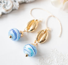 Load image into Gallery viewer, Cowrie Shell Earrings, Cowry Earrings, 18K Gold plated Blue Drop Earrings, Pacific Ocean Blue Swirl Lampwork Glass Bead, Beach Jewelry
