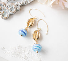 Load image into Gallery viewer, Cowrie Shell Earrings, Cowry Earrings, 18K Gold plated Blue Drop Earrings, Pacific Ocean Blue Swirl Lampwork Glass Bead, Beach Jewelry
