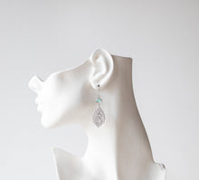 Load image into Gallery viewer, Silver Paisley Filigree Earrings with Aqua Mint blue Crystals
