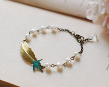 Load image into Gallery viewer, Gold Feather Blue Swallow Cream Pearls Bracelet.Brass feather Blue verdigris Patina Brass Swallow Bird Swarovski Cream pearls Bracelet
