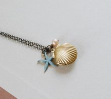 Load image into Gallery viewer, Starfish Shell Locket Necklace. Gold Brass Sea Shell locket, Blue Verdigris Starfish, Light Pink Pearl. Mermaids Locket
