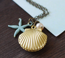 Load image into Gallery viewer, Starfish Shell Locket Necklace. Gold Brass Sea Shell locket, Blue Verdigris Starfish, Light Pink Pearl. Mermaids Locket
