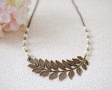 Load image into Gallery viewer, Large Leaf  Branch Necklace. Antiqued Brass Leaf Cream Ivory Pearls Necklace. Leaf Choker, Bridal jewelry, Woodland Jewelry, wedding
