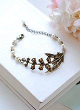 Load image into Gallery viewer, Lily of the Valley Bracelet Cream White Pearls Antiqued Brass Flower Bracelet Vintage Wedding Bridal Bracelet lily of the valley jewelry
