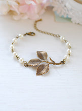 Load image into Gallery viewer, Leaf Bracelet Antiqued Brass Leaf Sprig White Cream Pearls Adjustable Bracelet Woodland Wedding Jewelry Bridal Bracelet mothers day gift
