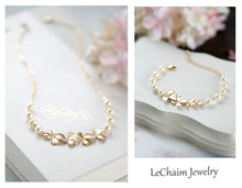 Load image into Gallery viewer, Matte Gold Flowers Cream White Teardrop Pearls Earrings. Bridal Earrings.
