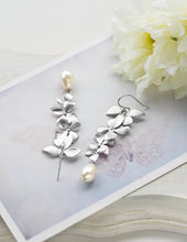 Load image into Gallery viewer, Silver Cascading Orchid Flowers Cream Teardrop Pearls Earrings. Bridal Earrings
