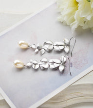 Load image into Gallery viewer, Silver Cascading Orchid Flowers Cream Teardrop Pearls Earrings. Bridal Earrings
