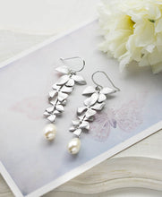 Load image into Gallery viewer, Silver Cascading Orchid Flowers Cream Teardrop Pearls Earrings. Bridal Earrings
